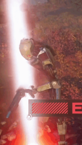 A Robot Is Standing Next To A Sign That Says E GIF