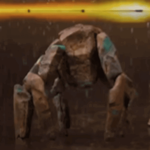 A Robot Is Standing On Its Hind Legs In A Dark Room With A Yellow Light Behind It . GIF