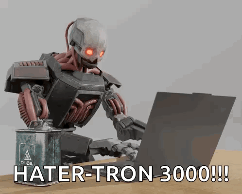 A Robot Is Typing On A Laptop Next To A Can Of Oil GIF