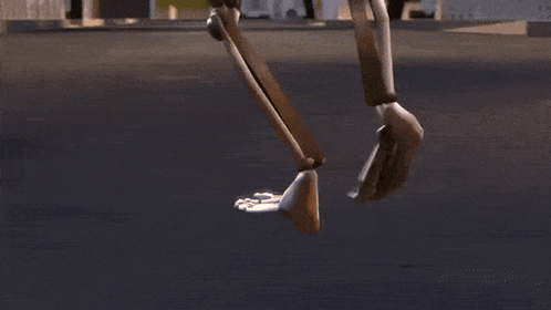 a robot is walking down a street in a video game