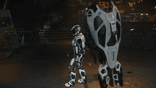 A Robot Standing Next To A Sign That Says Wake Up On It GIF