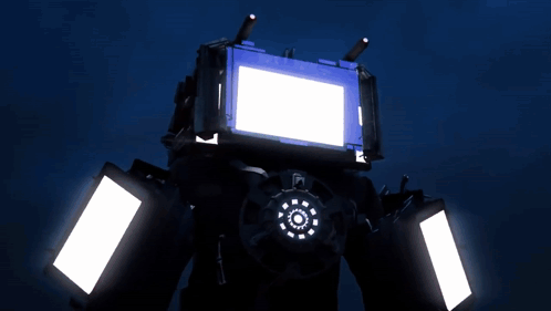 A Robot With A Blue Screen And White Lights GIF