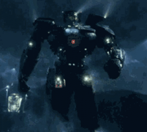 A Robot With A Red Light On Its Head Stands In The Dark GIF