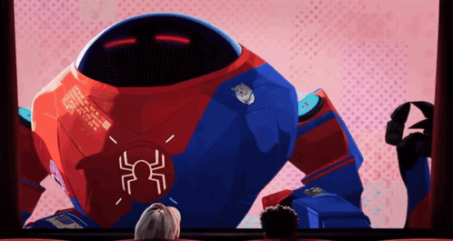 A Robot With A Spider On It 'S Chest Is Being Shown On A Screen GIF