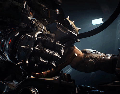 A Robot With Horns Is Standing In A Dark Room With A Light Shining On Him GIF