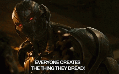 A Robot With Red Eyes And The Words Everyone Creates The Thing They Dread Below It GIF