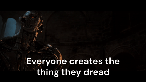A Robot With The Words Everyone Creates The Thing They Dread On The Bottom GIF