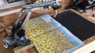 A Robotic Arm Is Reaching For A Walmart Map GIF