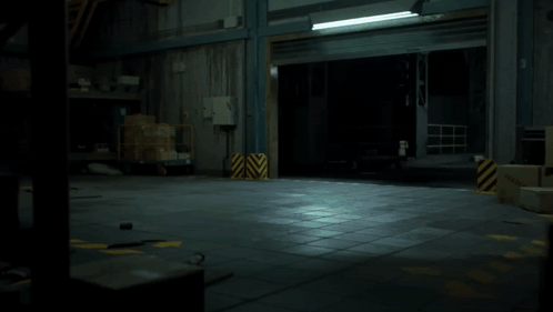 A Robotic Clown With A Red Nose And A Red Circle Around His Neck GIF