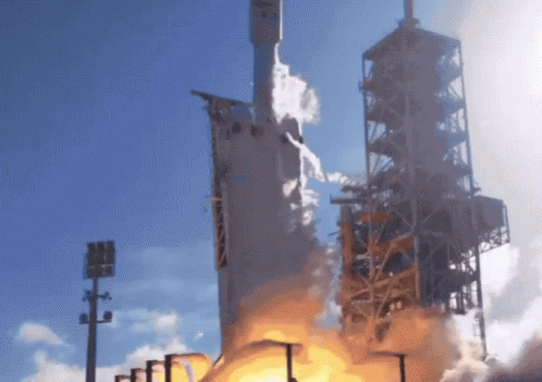 A Rocket Is Being Launched Into The Sky With Smoke Coming Out Of It GIF