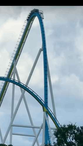A Roller Coaster Is Going Up A Very Steep Curve GIF