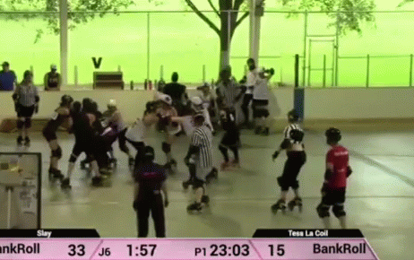 A Roller Derby Game Is Being Played On A Rink GIF