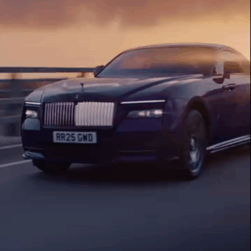 A Rolls Royce Car With A License Plate That Says Rr25 Gwd GIF