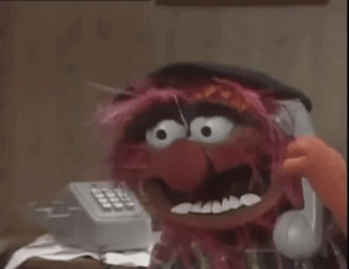 A Room With A Dresser And A Telephone With The Numbers 1 Through 9 On It GIF