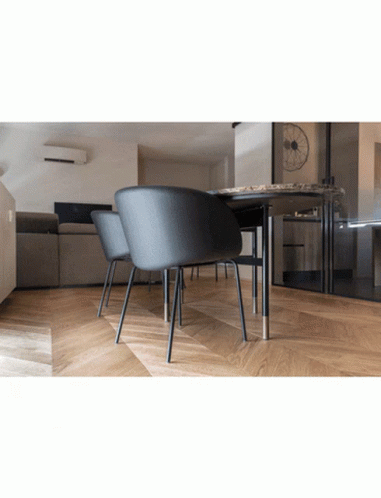 A Room With A Table And Chairs And A Couch GIF