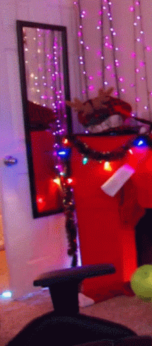 a room with christmas lights hanging on the wall