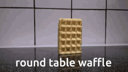 A Round Table Waffle Sits On A Counter Top GIF