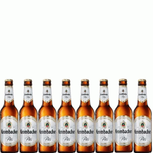 A Row Of Bottles Of Krombacher Beer Are Lined Up In A Row GIF