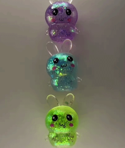 A Row Of Glow In The Dark Toys In The Shape Of A Bee . GIF