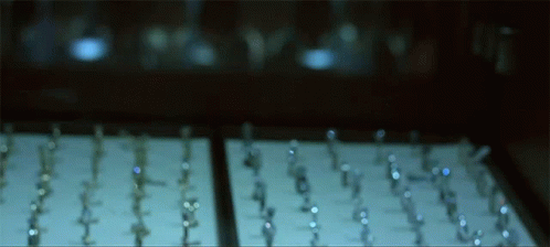 A Row Of Rings Are Displayed On A Table GIF