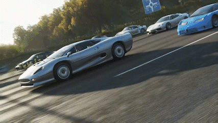 A Row Of Sports Cars Are Driving Down A Highway With A Sign That Says ' A Few Miles Ahead ' GIF