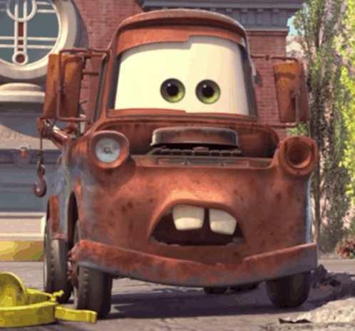 A Rusty Tow Truck From The Movie Cars With A Big Mouth GIF