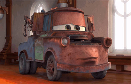 A Rusty Tow Truck With A Green Sign On The Back That Says ' Mater ' GIF