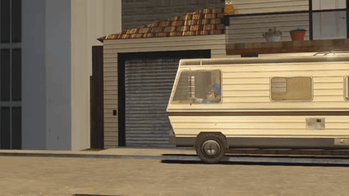 A Rv Is Parked In Front Of A House With A Garage Door GIF