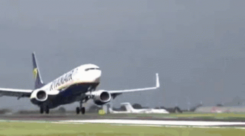 A Ryanair Airplane Is Flying Through The Air GIF