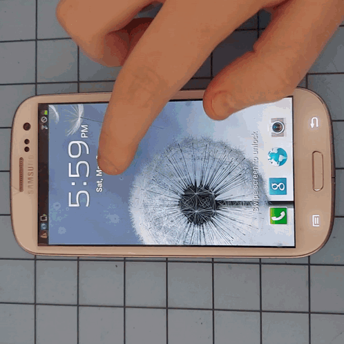 A Samsung Phone Displays The Time As 5:59 GIF