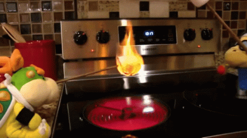 A Samsung Stove With A Marshmallow Being Cooked On It GIF
