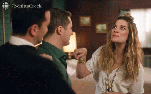 A Scene From Schitt 'S Creek With A Woman Making A Face GIF