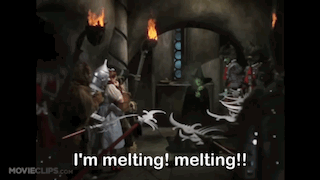A Scene From The Movie Wizard Of Oz With The Words I 'M Melting Melting !! GIF