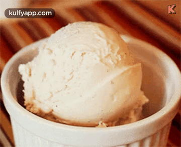 A Scoop Of Vanilla Ice Cream In A White Bowl With Kulfyapp.com In The Corner GIF