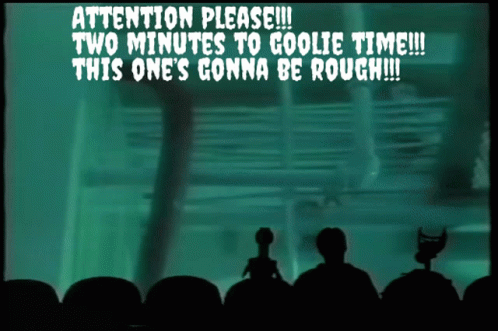 A Screen Says " Attention Please Two Minutes To Goolie Time This One 'S Gonna Be Rough " GIF