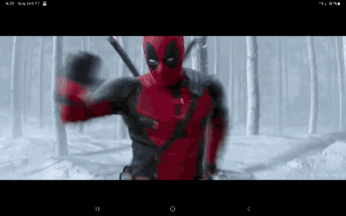 A Screen Shot Of A Deadpool Movie On A Cell Phone GIF