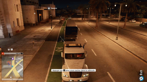 A Screenshot Of A Video Game Shows A Bus And A Truck Driving Down A Street At Night GIF