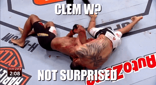 a screenshot of a wrestling match with the words clem w not surprised zoom
