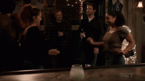 A Seahawks Banner Hangs On The Wall Above A Bar GIF