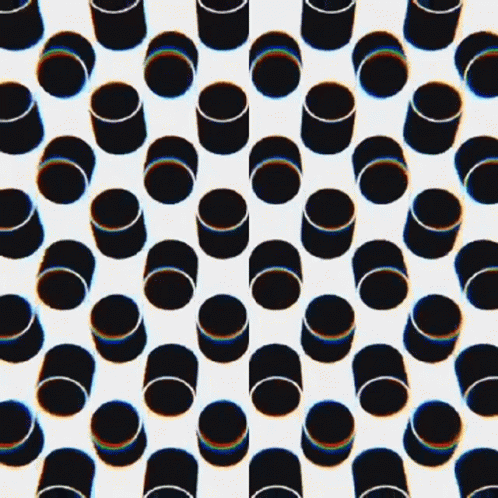A Seamless Pattern Of White Circles And Dots On A Black Background GIF