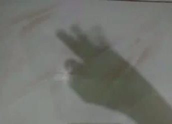 A Shadow Of A Person 'S Hand Pointing At Something GIF