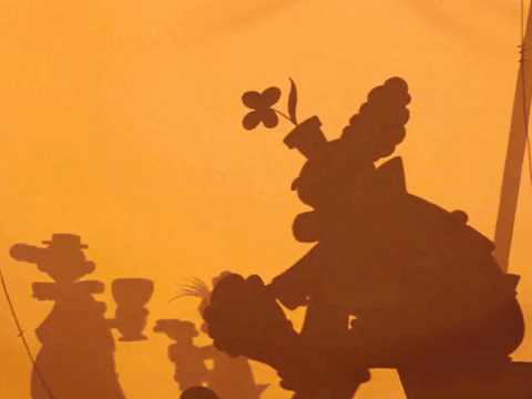 A Shadow Of Goofy Is Cast On A Yellow Wall GIF