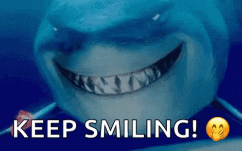A Shark Is Smiling With The Words Keep Smiling Written Below It GIF