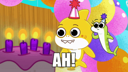 A Shark Wearing A Party Hat Stands Next To A Cake With Candles GIF
