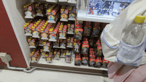 A Shelf Full Of Toys With One That Says ' Pokemon ' GIF