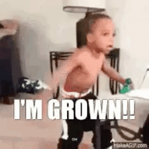 A Shirtless Baby Is Standing In A Room With The Words `` I 'M Grown ! '' GIF