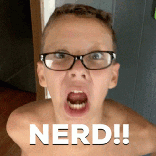 A Shirtless Boy Wearing Glasses Is Making A Funny Face And The Word Nerd Is On The Bottom GIF