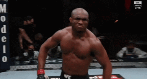 A Shirtless Fighter Stands In Front Of A Banner That Says Ufc Live GIF