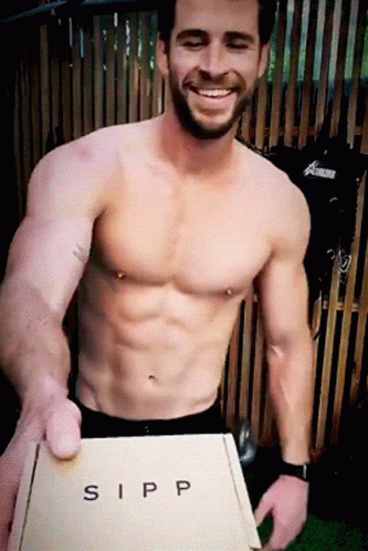 A Shirtless Man Holding A Box That Says Sipp GIF