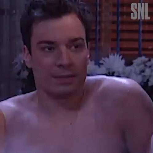 Shirtless Man In Bathtub With SNL Logo GIF